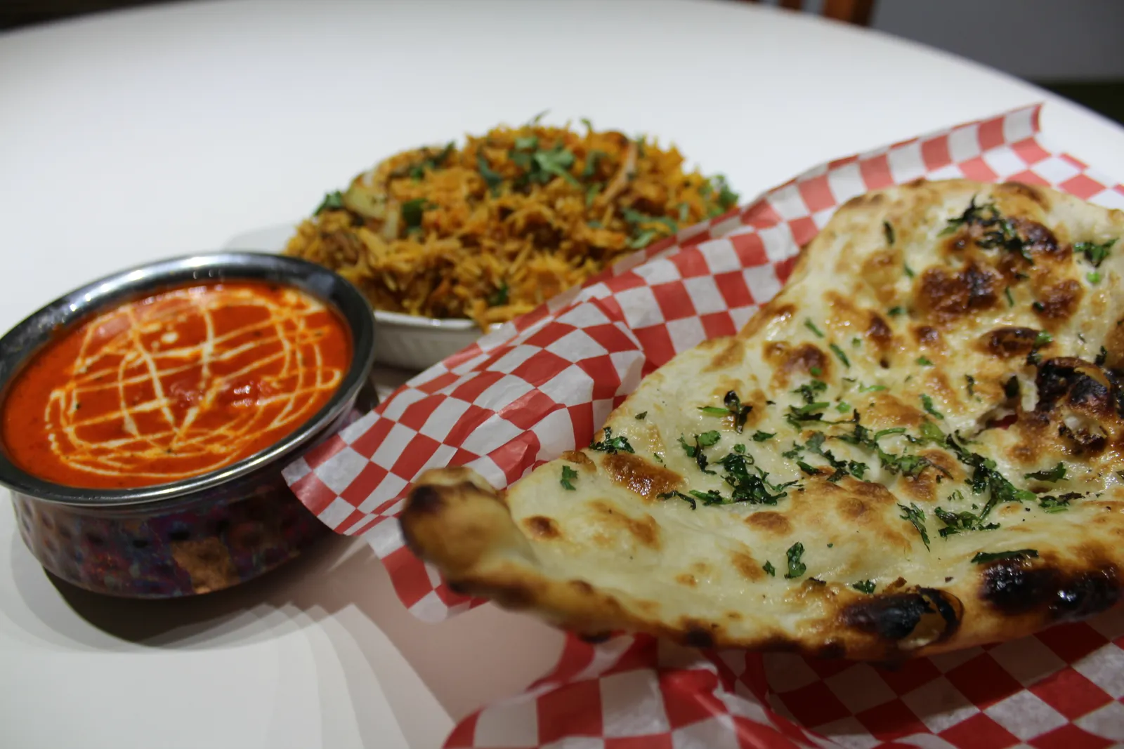 Butter chicken, biryani, and naan fresh from the Tanjore kitchen